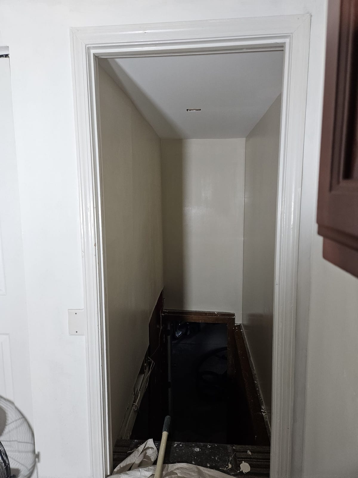 Interior staircase after refinishing with fresh paint and stain