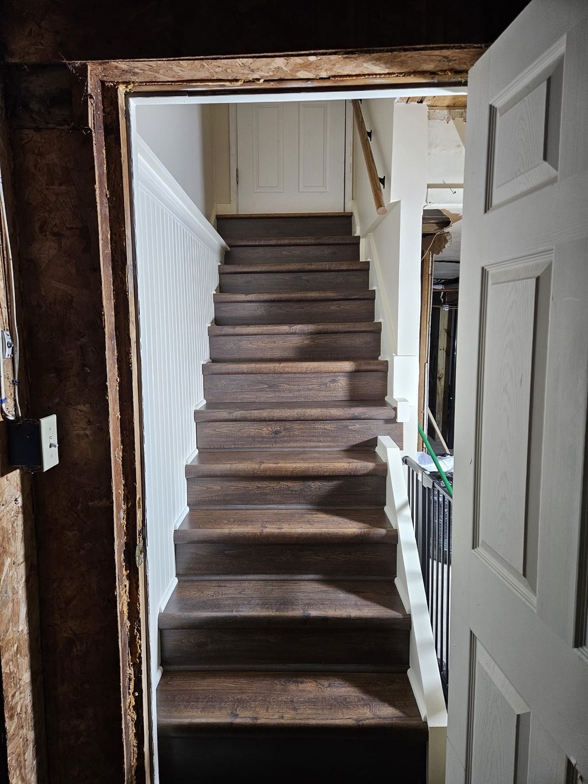 Refinished staircase with smooth stained treads